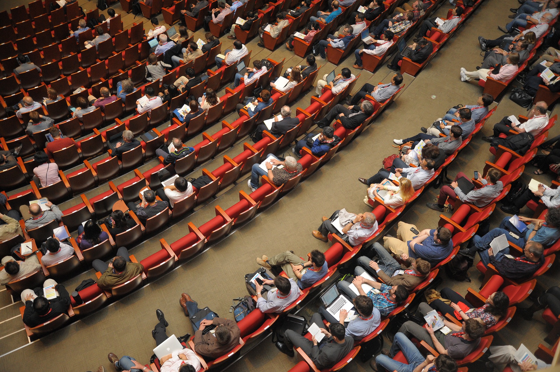 an above shot of eager listeners at a conference