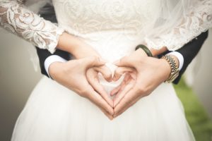 wedding photo of hands in a heart shape