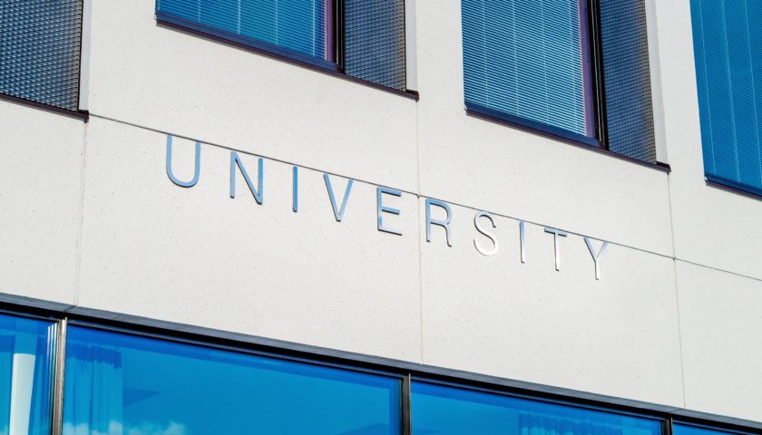 Building with university sign on it.