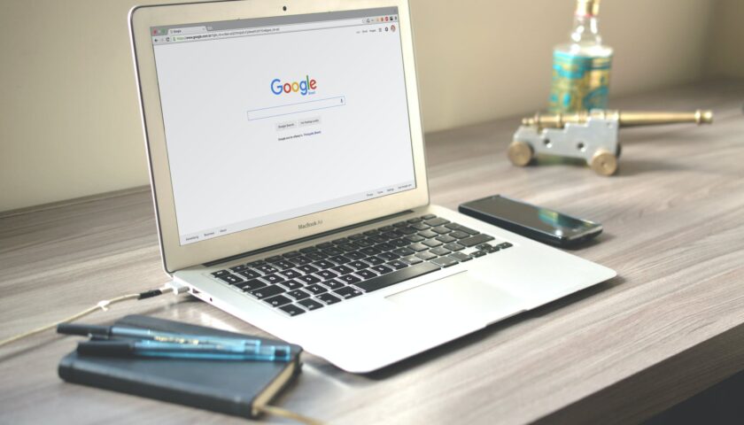 macbook air on grey wooden table