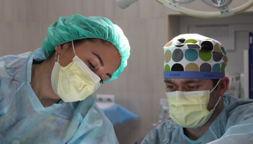 surgeons performing surgery